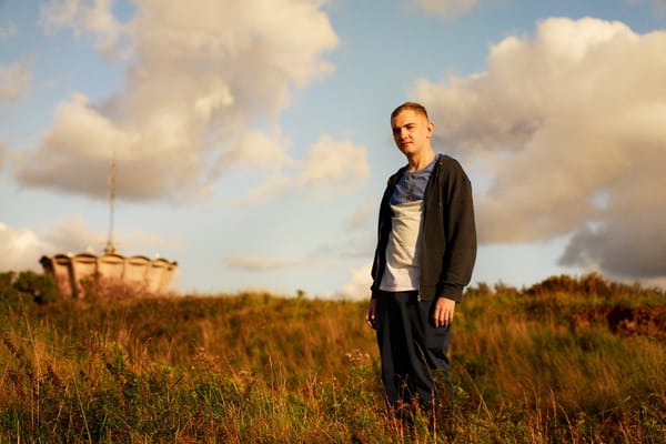 Still from the film Christy (2025) showing the title character in a field in Cork